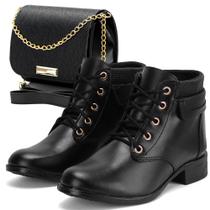 Bota feminina de salto médio e bico fino em verniz preto