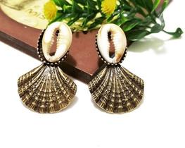 Brinco Concha com Búzios