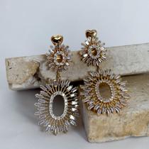 Brinco pendulo oval sol de zirconias