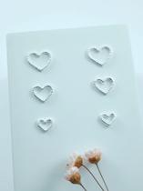 Brinco trio coração torcido