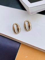 Brincos folheados ouro e prata modelo búzios tendência Praia