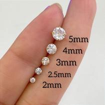 Brincos titânio ponto de luz com garrinha - dourado