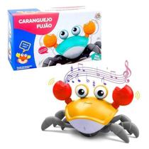 Brinquedo Caranguejo Fujão Toca Musica Sensor Indução Pilha