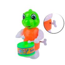 Brinquedo Dinossauro Movido à Corda Tocando Tambor Color - 56814