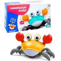 Brinquedo Musical Caranguejo Fujão Joe Sensor Indução Kids