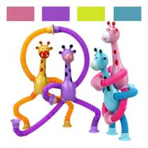 Brinquedo Sensorial Girafa Melman Com Luz E Ventosa Kit 4 Un