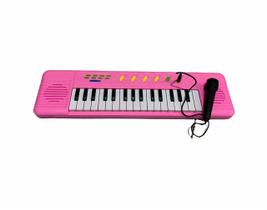 Brinquedo Teclado infantil a pilha rosa