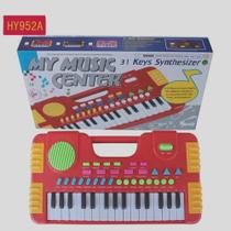 Brinquedo teclado piano com som e luzes