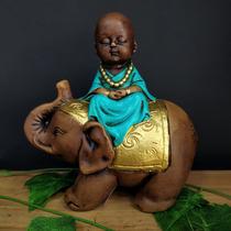 Buda sentado no elefante mãos postas turquesa 18cm Buda sentado no elefante mãos postas turquesa 18cm