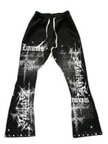 Calça de moletom WDIRARA Y2k com estampa gráfica de letras para homens preta XL Calça de moletom WDIRARA Y2k com estampa gráfica de letras para homens preta XL