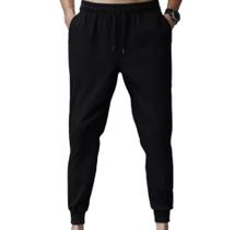 Calça em moletom flanelado cor preta com 2 bolsos e cordão de ajuste unissex barra com punhos Calça em moletom flanelado cor preta com 2 bolsos e cordão de ajuste unissex barra com punhos