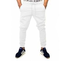 calça jeans jogger masculina jeans rasgado, sarja com elastico e bolso