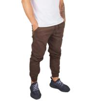 calça jeans jogger masculina jeans rasgado, sarja com elastico e bolso
