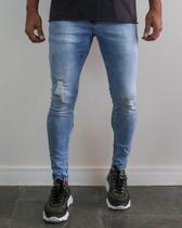 Calça jeans super skinny lavagem media puida - creed jeans