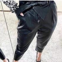 Calça material sintético