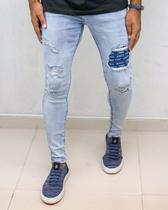 Calça skinny rasgada patch mcmxciii clara - creed jeans