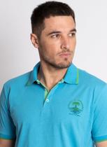 Camisa Polo Aleatory Tropical Paradise Azul Camisa Polo Aleatory Tropical Paradise Azul