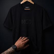 Camiseta MCD Box Fit Relevo Black - Estilo Minimalista e Confortável Camiseta MCD Box Fit Relevo Black - Estilo Minimalista e Confortável