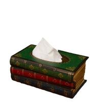 Capa de lenços, porta-lenços, dispensador, livros rústicos empilhados