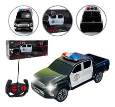 Carrinho Controle Remoto Polícia Preto Caminhonete Hilux Boy Diversão e Aventura Carrinho Controle Remoto Polícia Preto Caminhonete Hilux Boy Diversão e Aventura