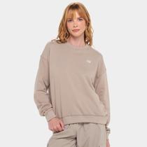 Casaco New Balance Small Logo Feminino Casaco New Balance Small Logo Feminino