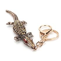 Chaveiro Crocodilo com olhos vermelhos e strass Chaveiro Crocodilo com olhos vermelhos e strass