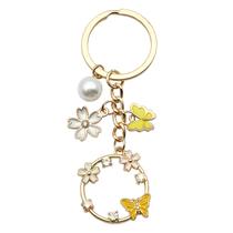 Chaveiro Flor de Borboleta Amarela com Pérola e Strass