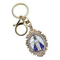 Chaveiro mosquetão aparecida manta azul strass oval dourado