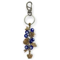 Chaveiro Olho Grego Cachos Azul Escuro e Dourado Chaveiro Olho Grego Cachos Azul Escuro e Dourado