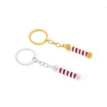 Chaveiro, tesoura de barbearia e design de poste de barbeiro