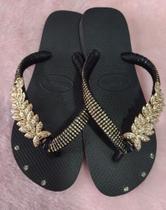 Chinelo havaianas top preto com peça folha 37/38 Chinelo havaianas top preto com peça folha 37/38
