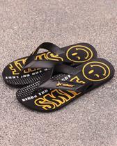 Chinelo rider street art smile preto e amarelo