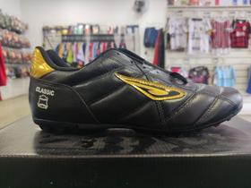 Chuteira Diavolo Classic Society - Preto/Dourado Chuteira Diavolo Classic Society - Preto/Dourado