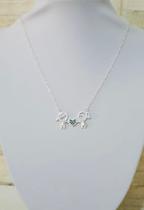 Colar com Pingente menina e menino com zircônia verde banhado prata Colar com Pingente menina e menino com zircônia verde banhado prata