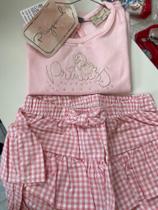 Conjunto blusa e shorts saia