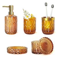 Conjunto de acessórios de banheiro LaMarriti Amber, 5 unidades de vidro transparente Conjunto de acessórios de banheiro LaMarriti Amber, 5 unidades de vidro transparente