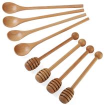 Conjunto de palitos de mel de madeira e colheres para mexer café