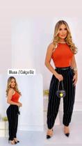 Conjunto feminina com calça e brusa