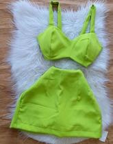 Conjunto feminino na cor verde Cropet com bojo saia com Short embaixo TAM P