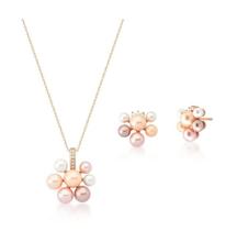 Conjunto flor em três tons banhado a ouro rosê