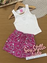 Conjunto Infantil Cinti Verão com Shorts Saia Rosa e Regata Branca Coração com Strass Conjunto Infantil Cinti Verão com Shorts Saia Rosa e Regata Branca Coração com Strass