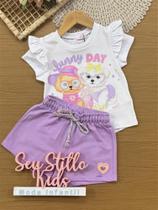 Conjunto Infantil Kukiê Verão com Shorts Lilás e Blusa Branca Cachorrinhas Funny Day Conjunto Infantil Kukiê Verão com Shorts Lilás e Blusa Branca Cachorrinhas Funny Day