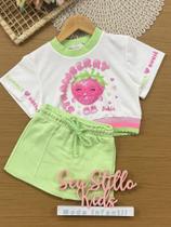 Conjunto Infantil Kukiê Verão com Shorts Saia Verde e Blusa Branca Moranguinho Conjunto Infantil Kukiê Verão com Shorts Saia Verde e Blusa Branca Moranguinho