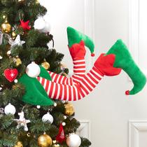 Decoração de chapéu de elfo de Natal com pernas grudadas na parte superior da árvore