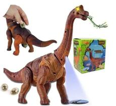 Dinossauro Anda Bota Ovo Som Luz E Movimento Projetor Animal - FUN GAME