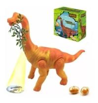 Dinossauro Anda Bota Ovo Som Luz Movimento Projetor LARANJA Com folha. Dinossauro Anda Bota Ovo Som Luz Movimento Projetor LARANJA Com folha.