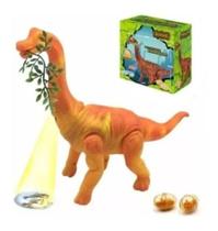 Dinossauro Anda Bota Ovo Som Luz Movimento Projetor LARANJA Com folha. Dinossauro Anda Bota Ovo Som Luz Movimento Projetor LARANJA Com folha.