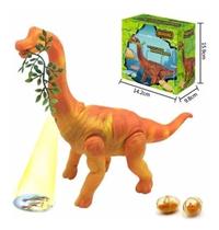 Dinossauro Anda Bota Ovo Som Luz Movimento Projetor Laranja Com folha Dinossauro Anda Bota Ovo Som Luz Movimento Projetor Laranja Com folha