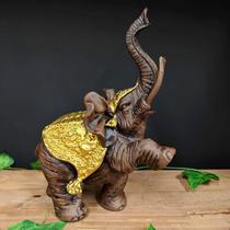 Elefante pata levantada envelhecido com dourado 28cm