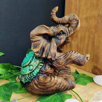 Elefante sentado turquesa 17cm